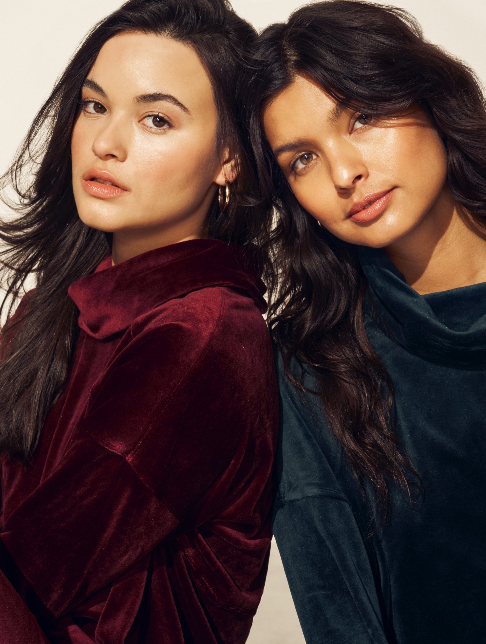 2 Anne Klein models leaning on each other wearing velour matching sets