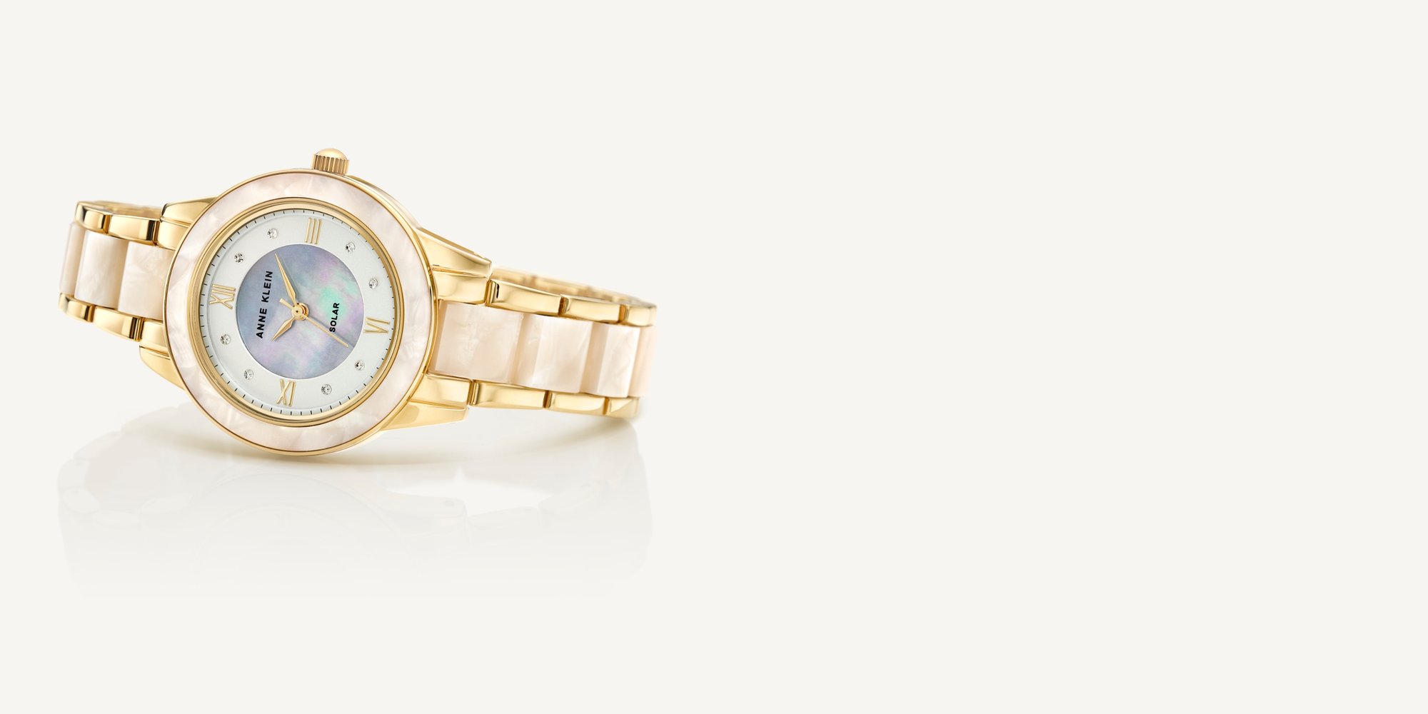 Anne Klein Gold and White Solar Powered Resin Watch